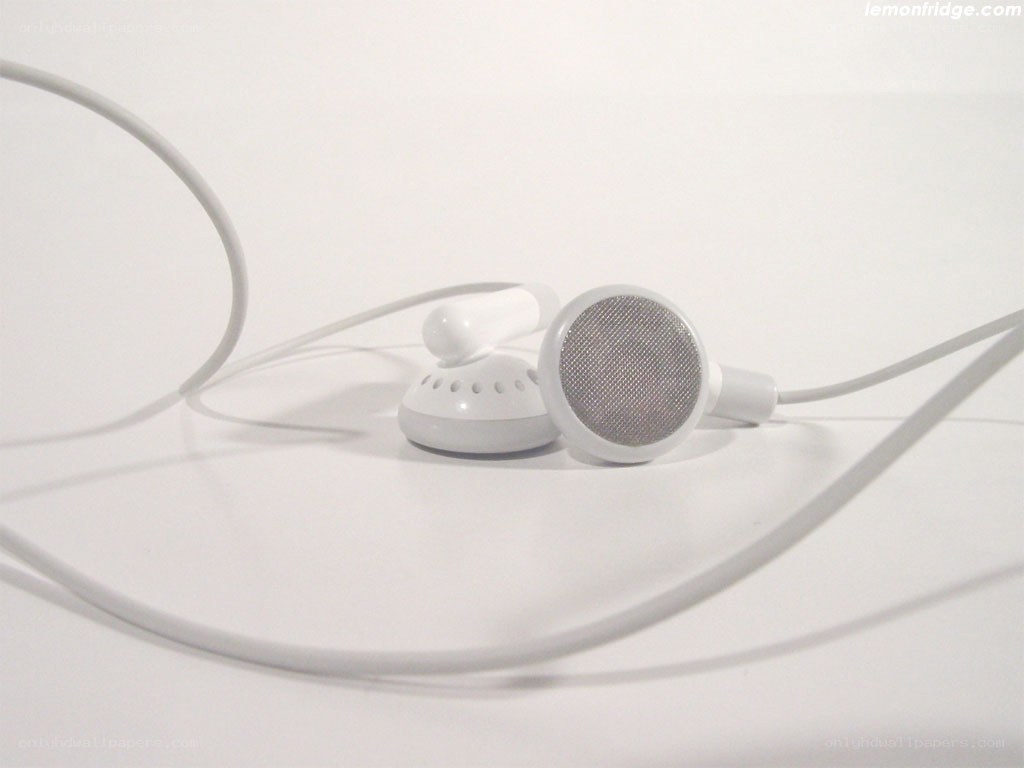white earbuds on white surface