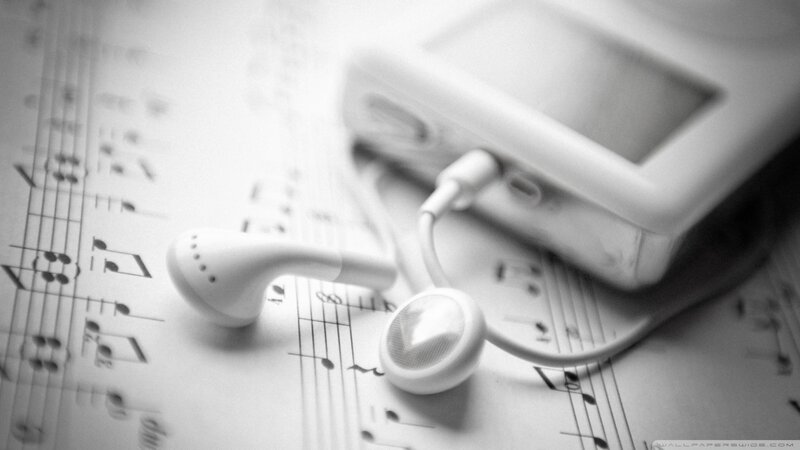 White Earphones on Sheet Music