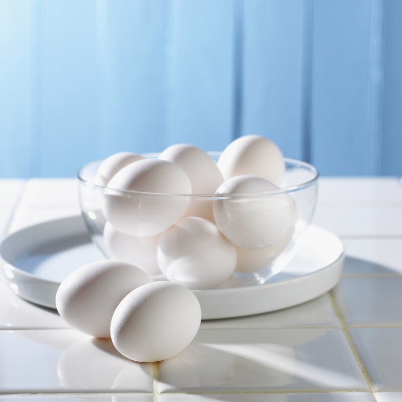 White eggs in a glass bowl