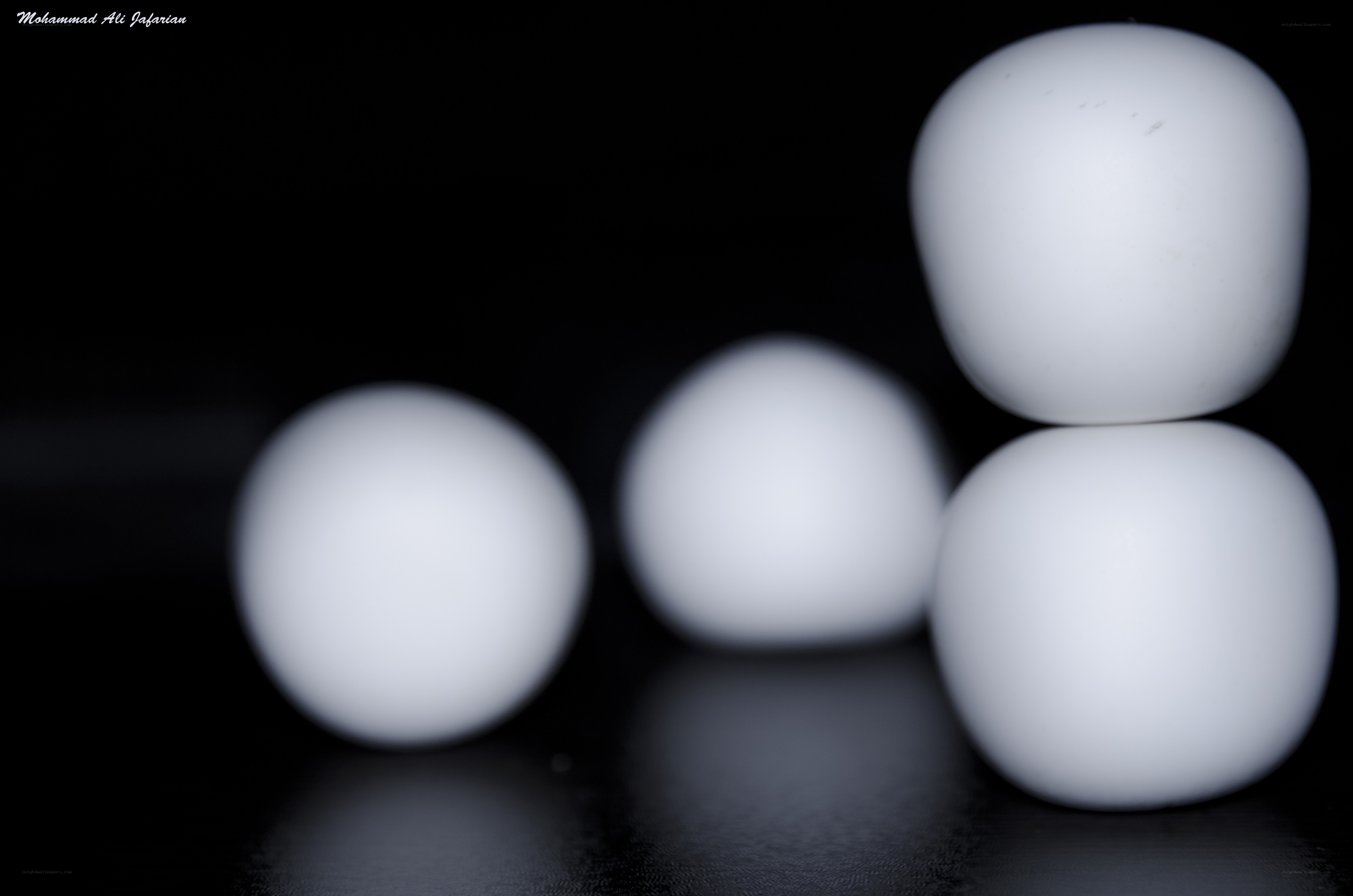 White eggs on black background