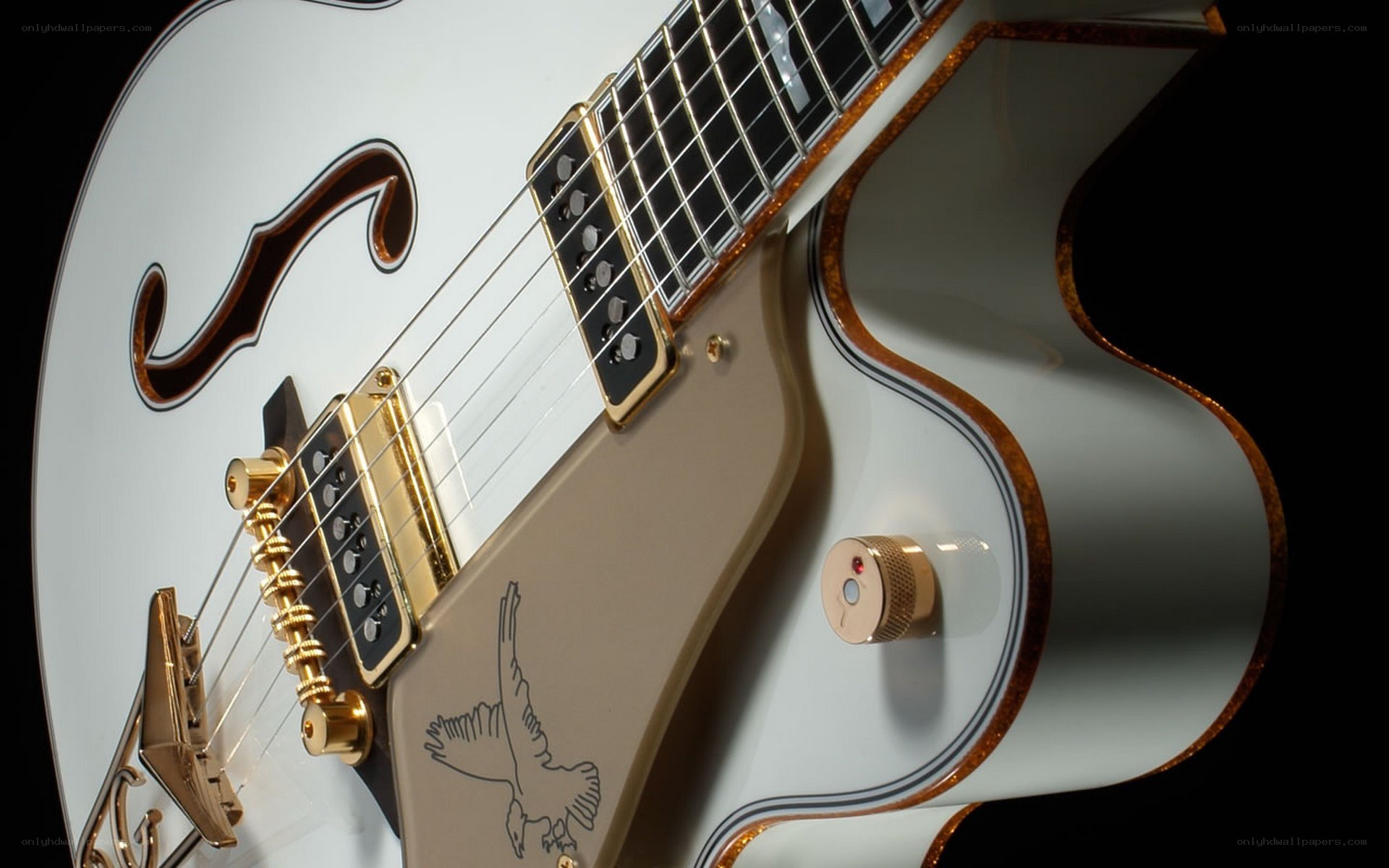 white electric guitar with gold hardware