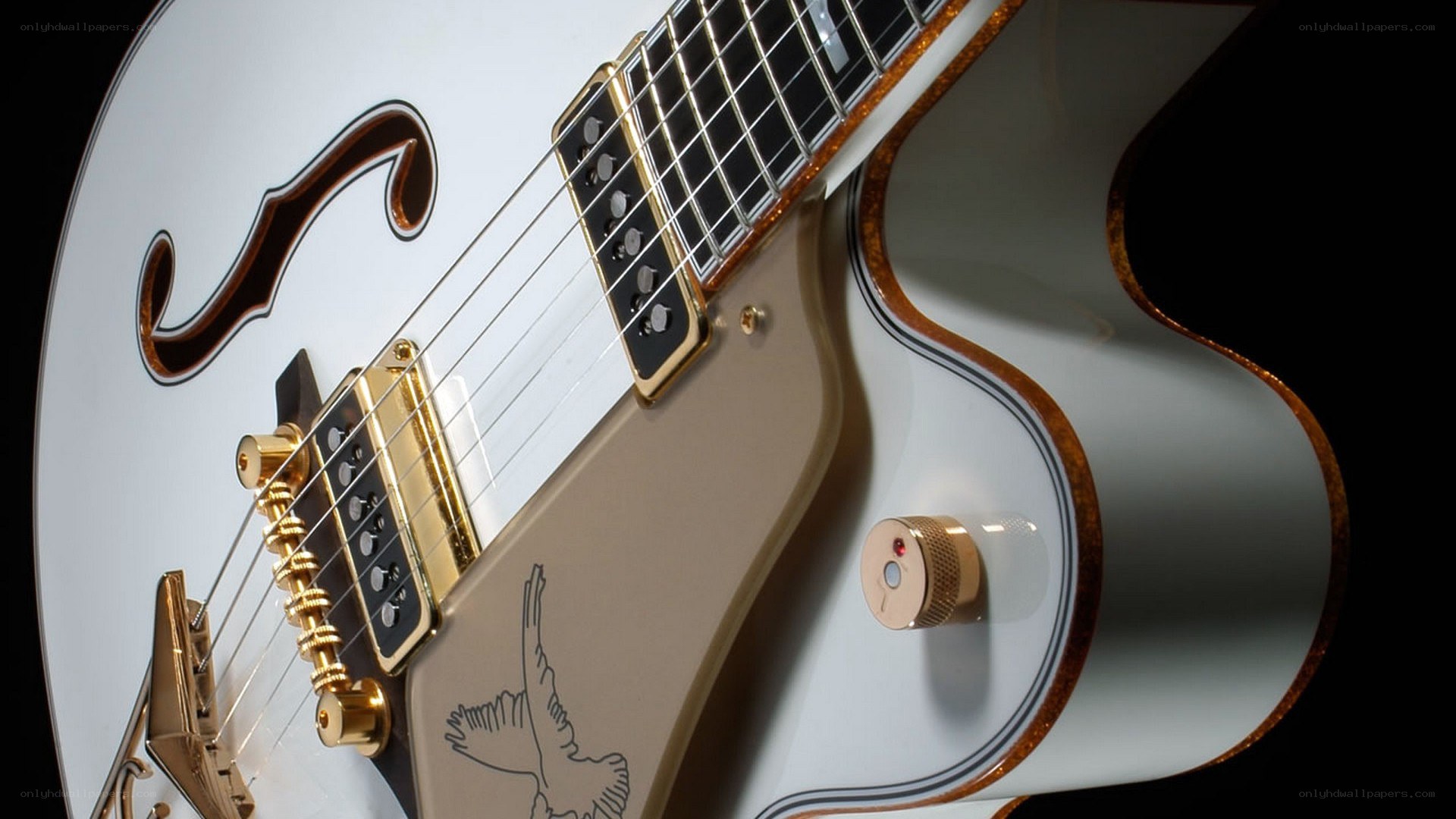 white electric guitar with gold hardware
