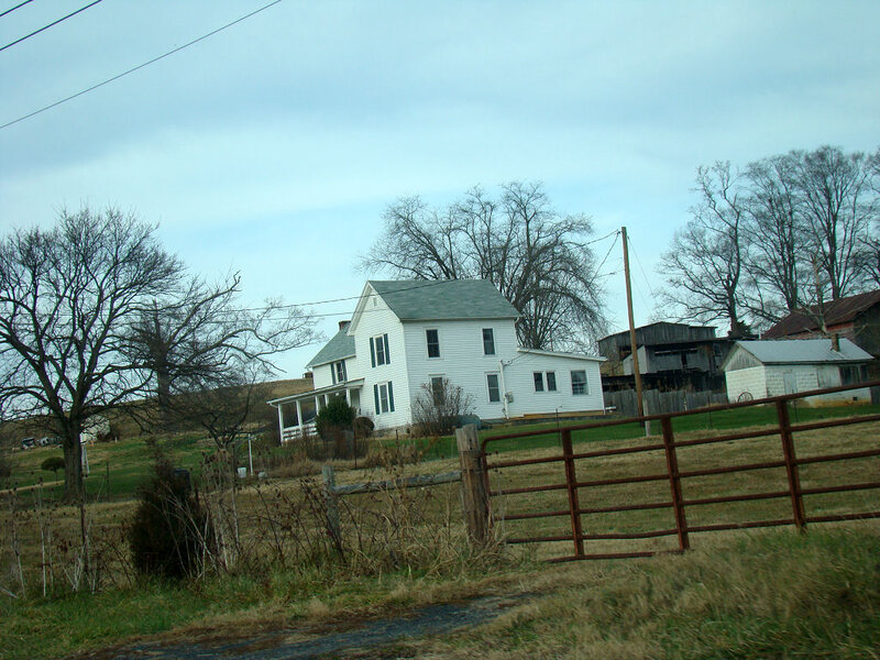 White Farmhouse on Hill