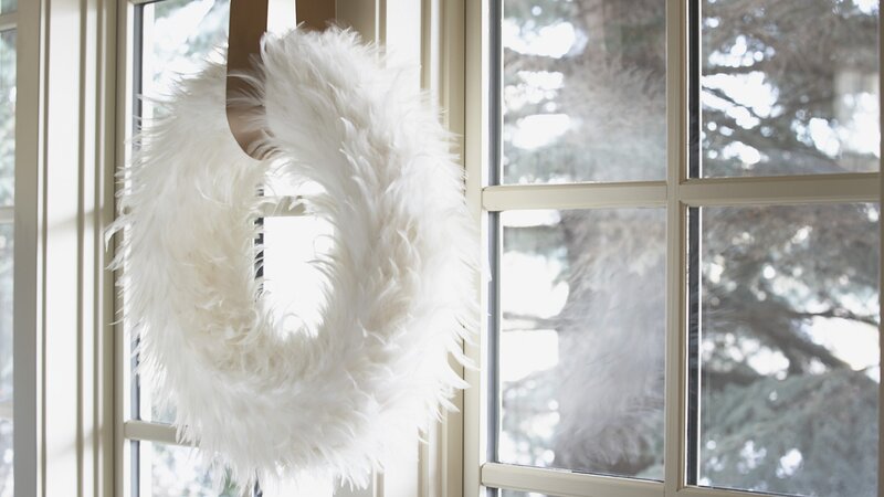 white feather wreath on window