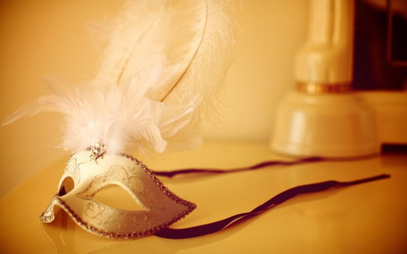 white feathered mask