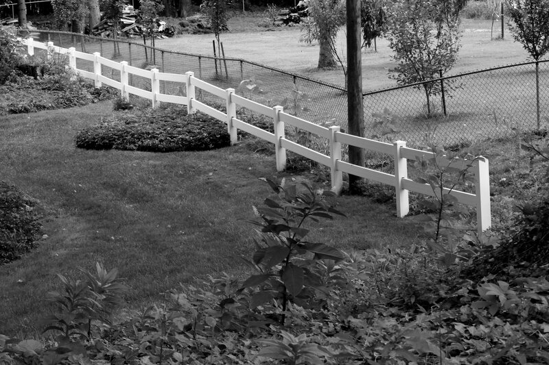 White Fence in Garden — Black