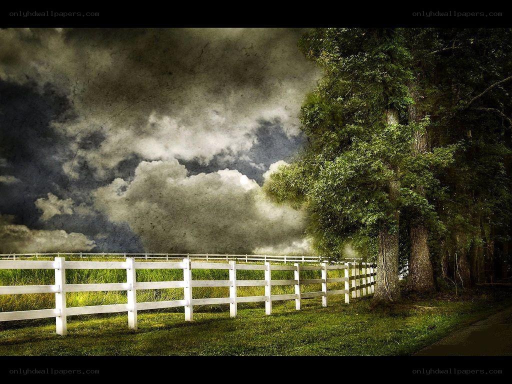 White fence under stormy sky