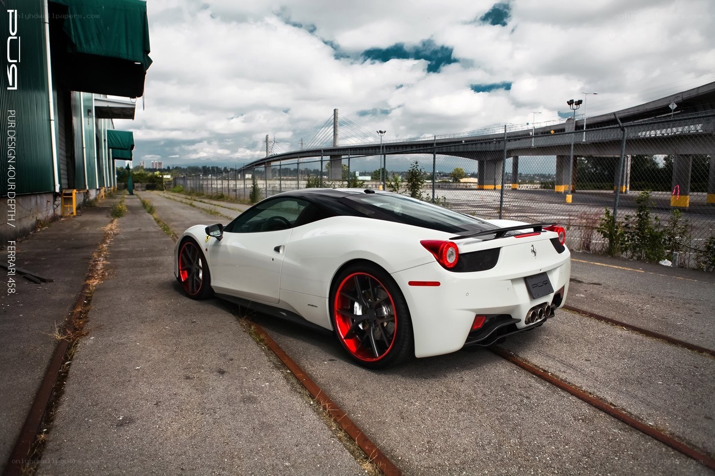 White Ferrari 458 on train tracks