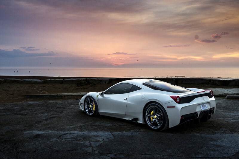 White Ferrari at sunset by the sea