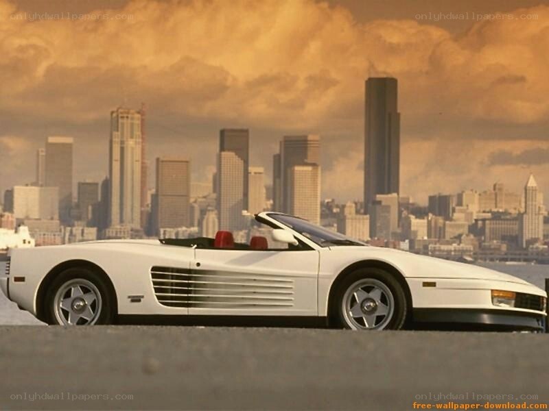 white ferrari convertible in city