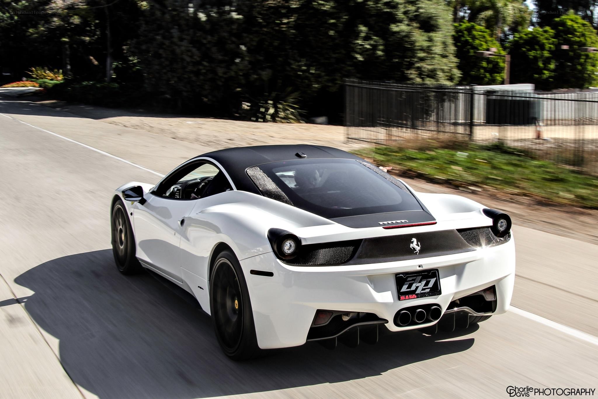 white ferrari driving on road