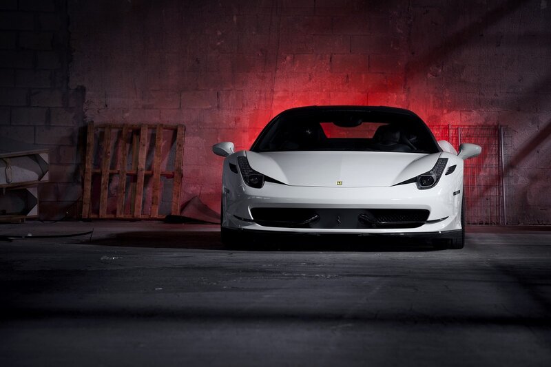 White Ferrari in a dimly lit garage