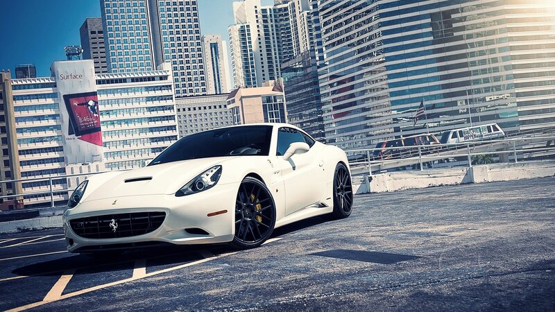 White Ferrari in city parking lot