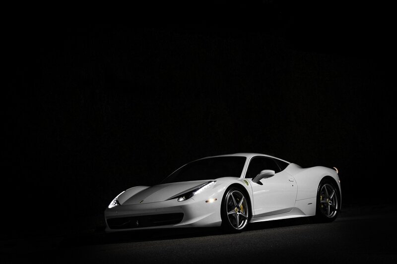 white ferrari in dark setting