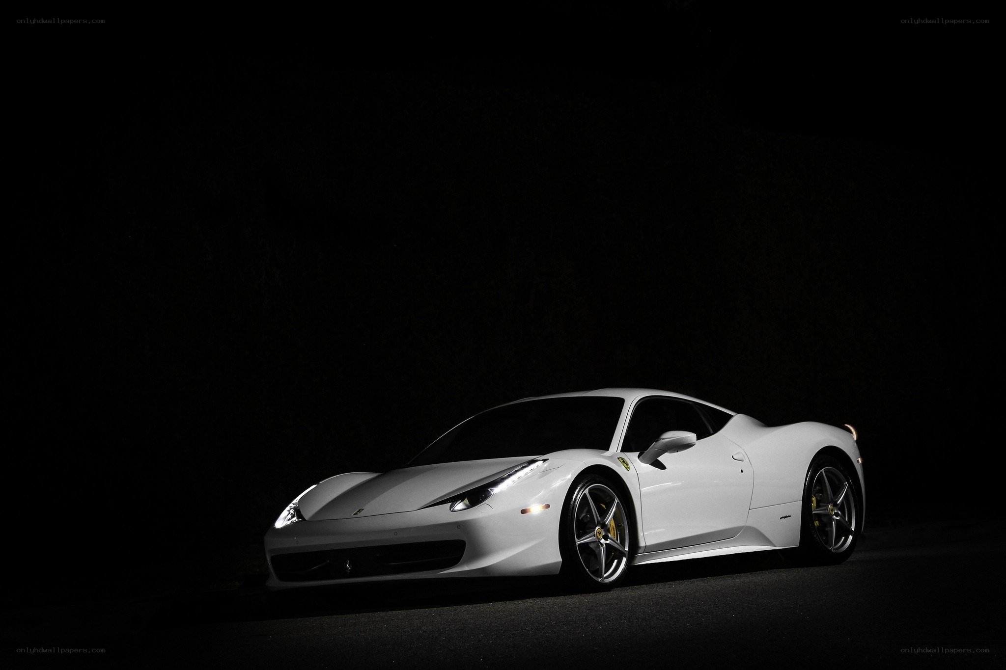 white ferrari in dark setting