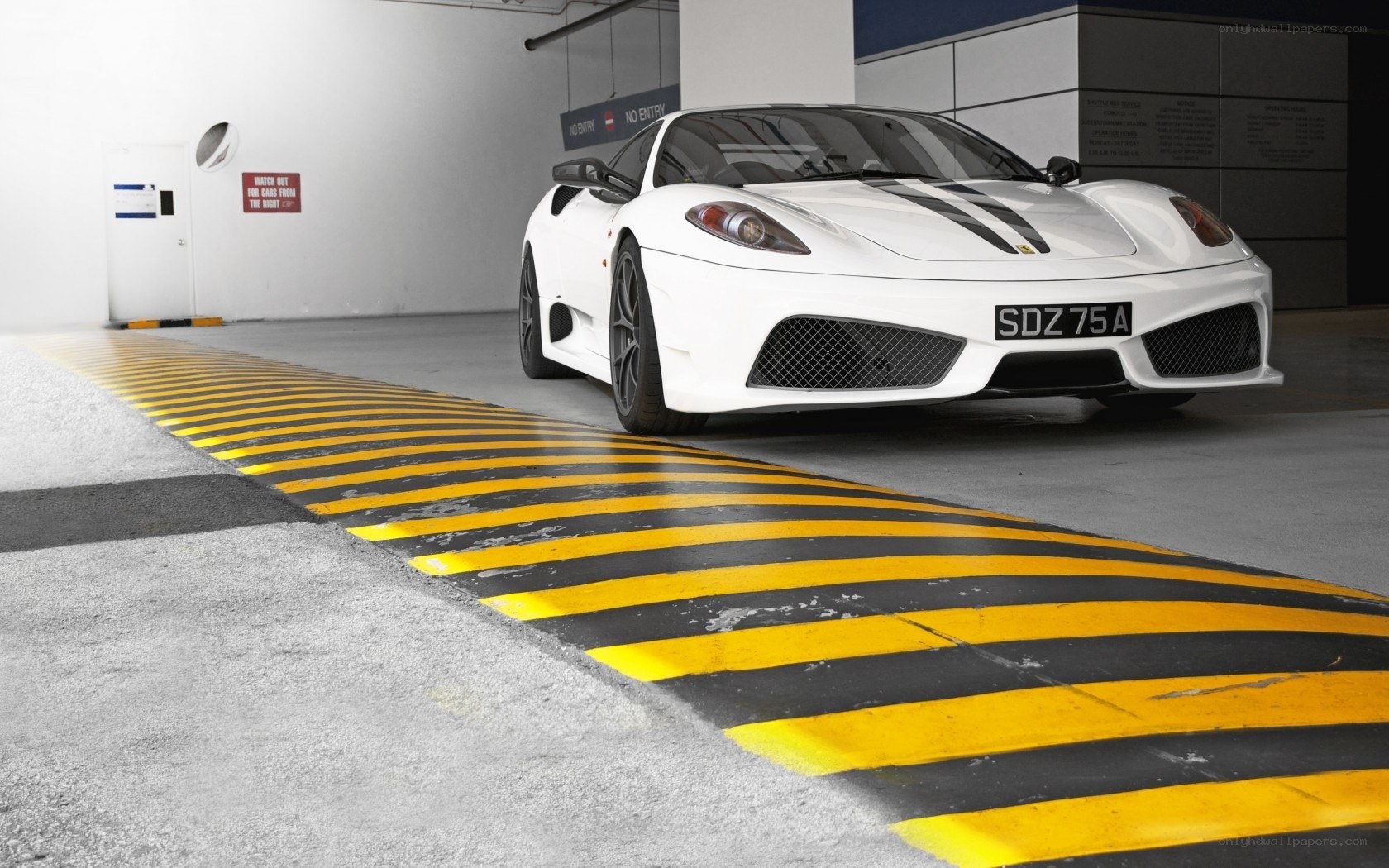 White Ferrari in parking garage