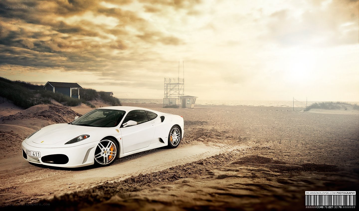 White Ferrari on a beach
