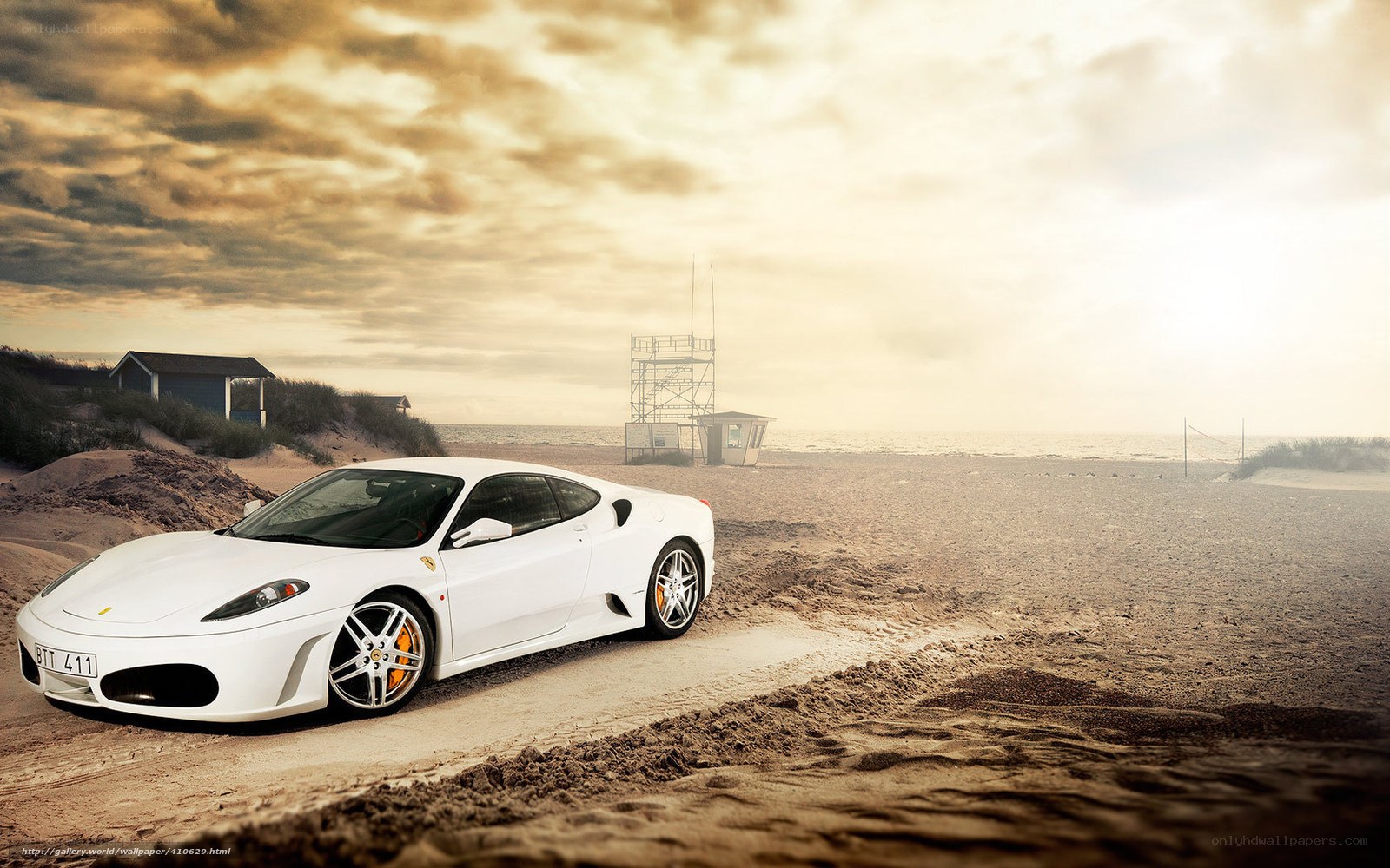 White Ferrari on a beach