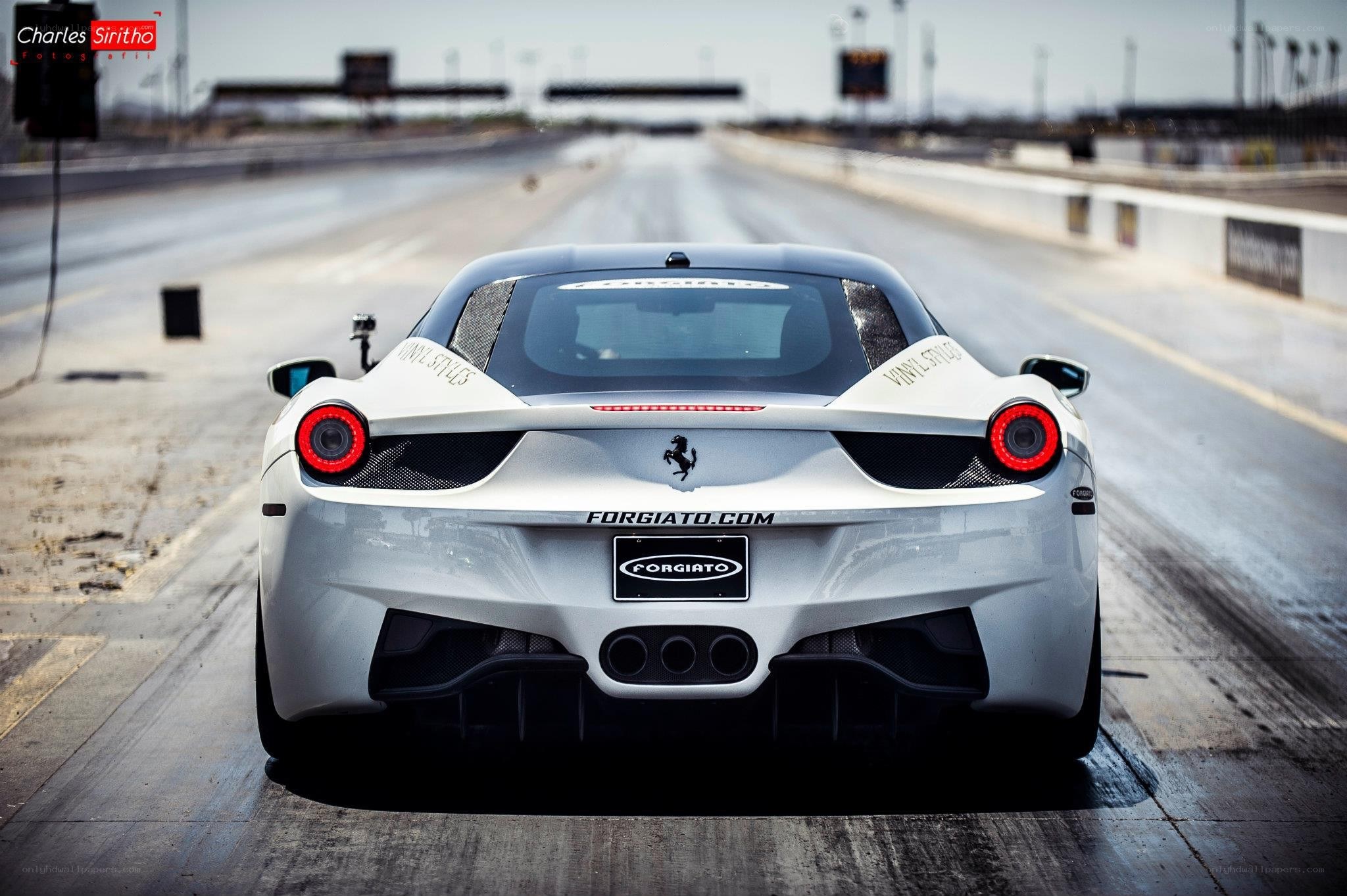 white ferrari on a racetrack