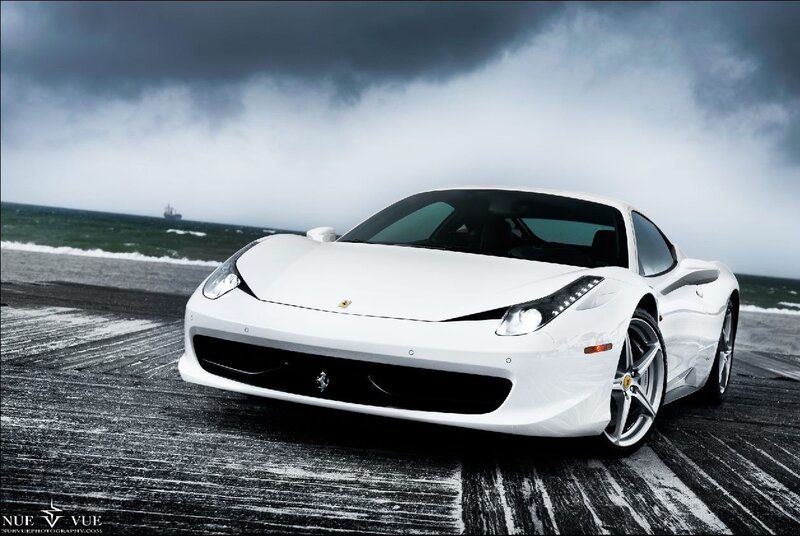 White Ferrari on a stormy beach