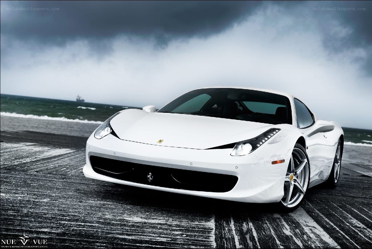 White Ferrari on a stormy beach