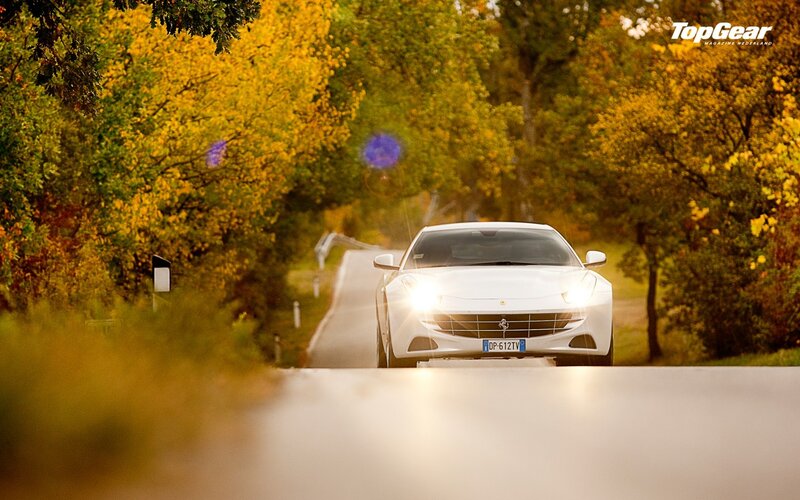 White Ferrari on autumn road