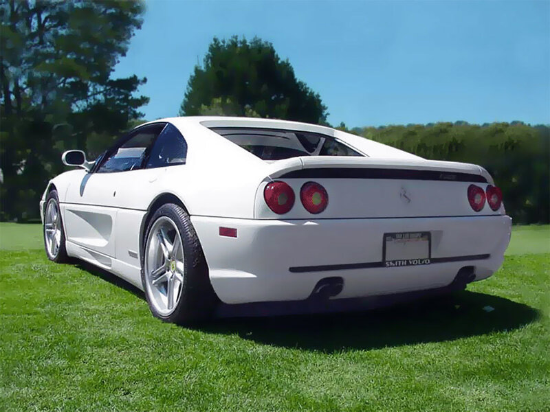 white ferrari on grass