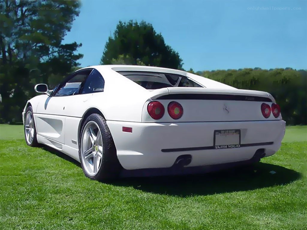 white ferrari on grass