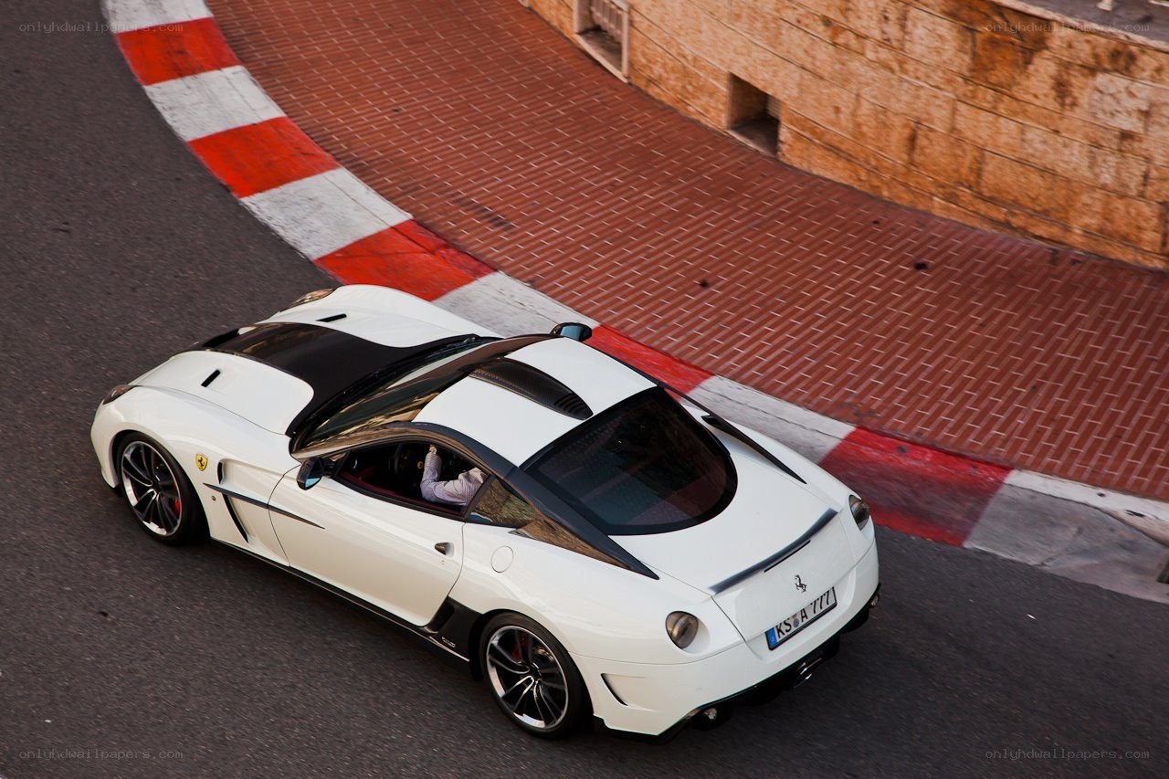 white ferrari on racetrack