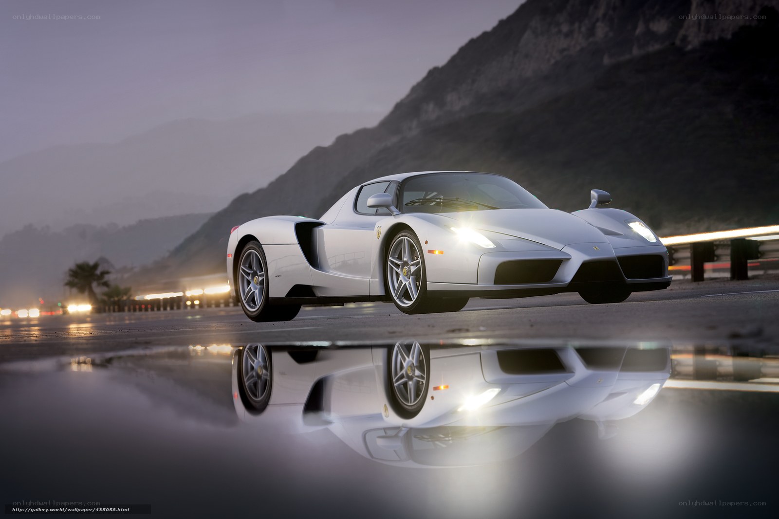 White Ferrari on wet road