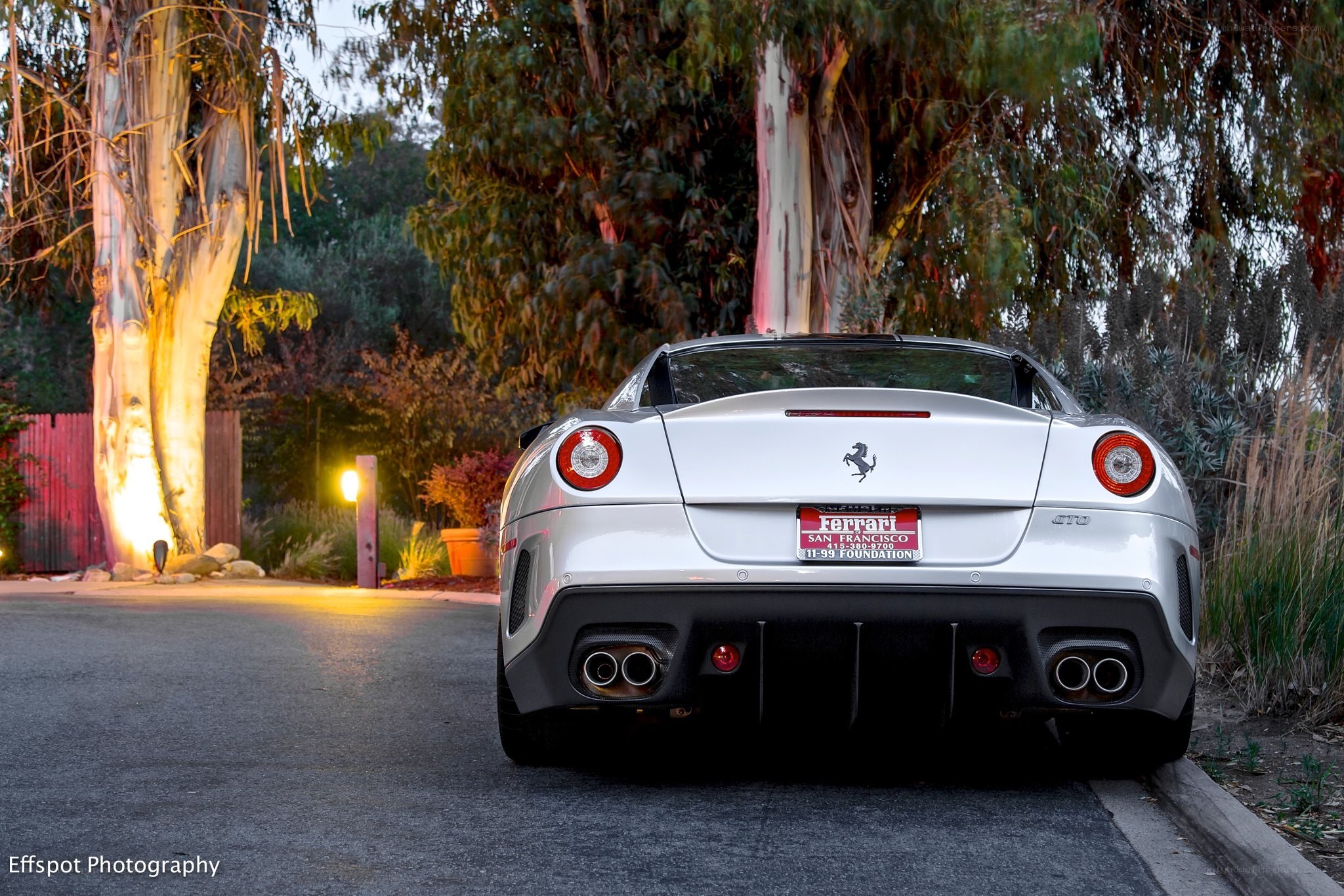 White Ferrari parked at dusk