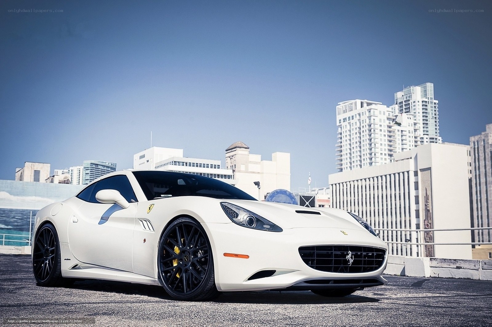 White Ferrari parked in city