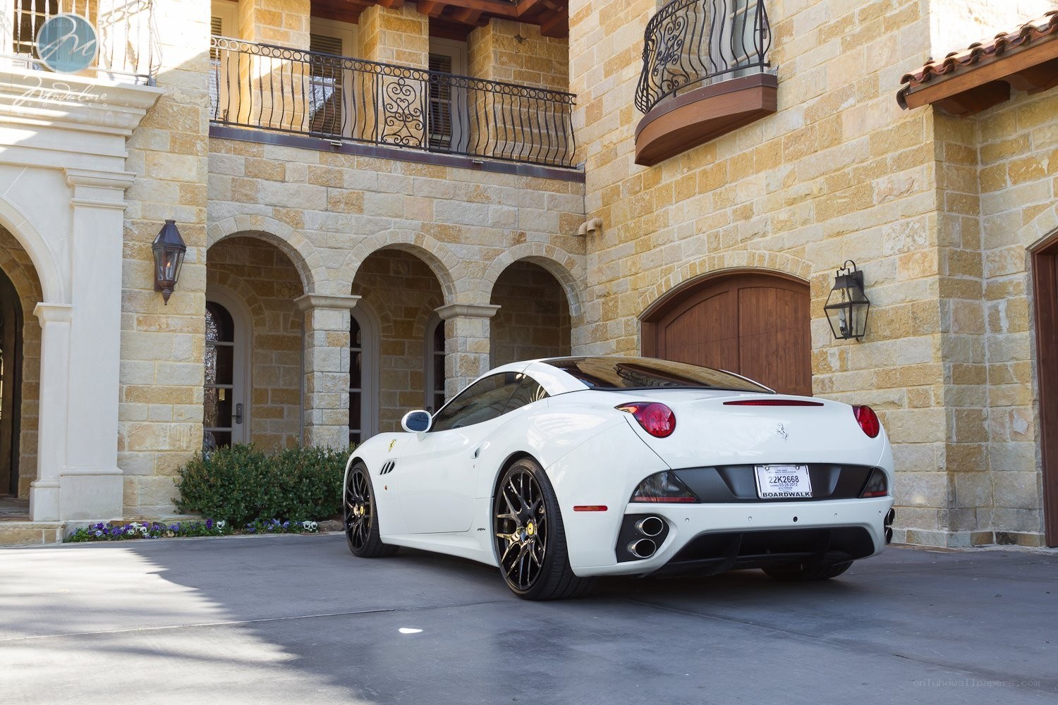 White Ferrari parked in driveway