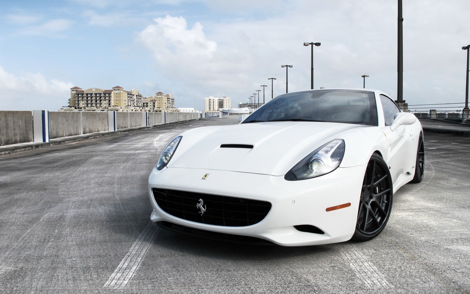 White Ferrari parked on a bridge
