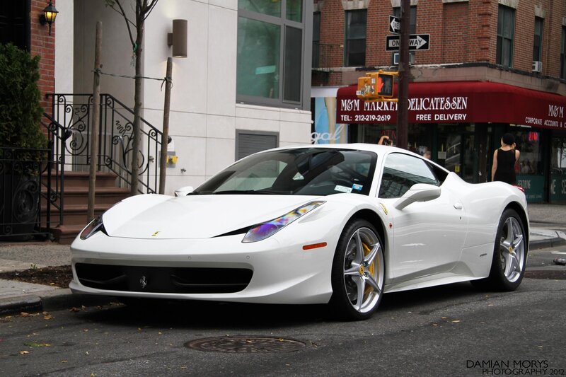 White Ferrari parked on street
