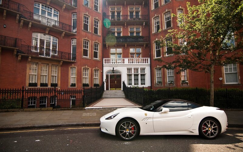 White Ferrari parked on street