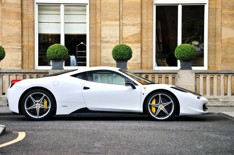 white ferrari parked on street