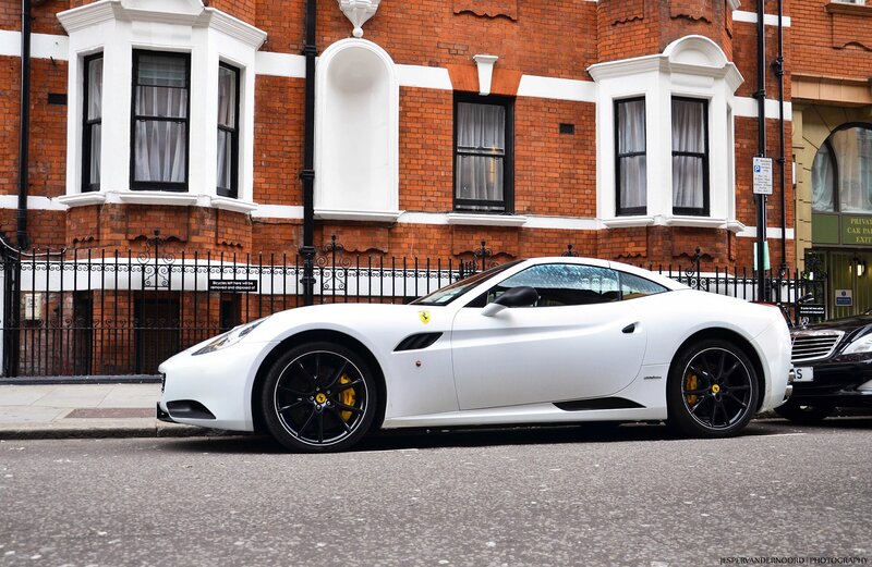White Ferrari parked on street