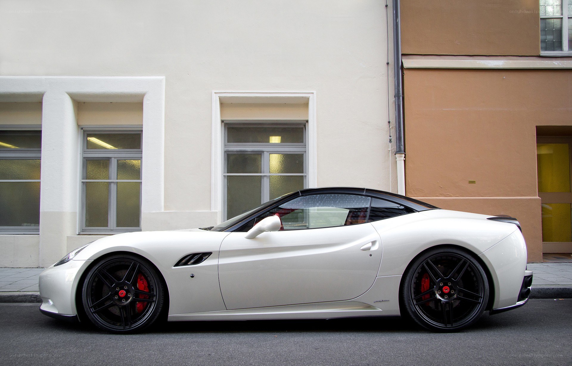 White Ferrari parked on street