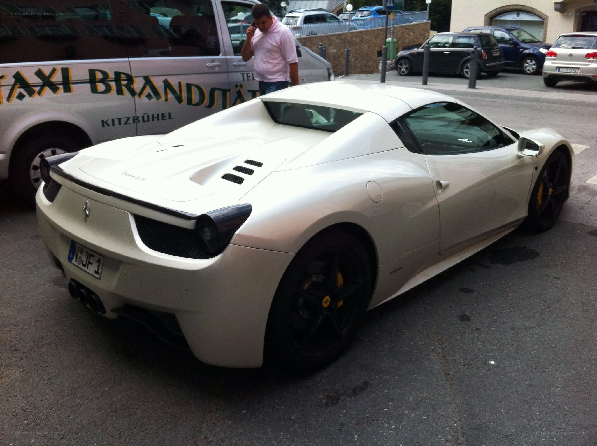 White Ferrari parked on street