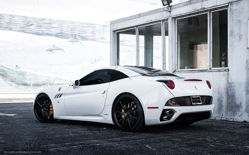 White Ferrari parked outside