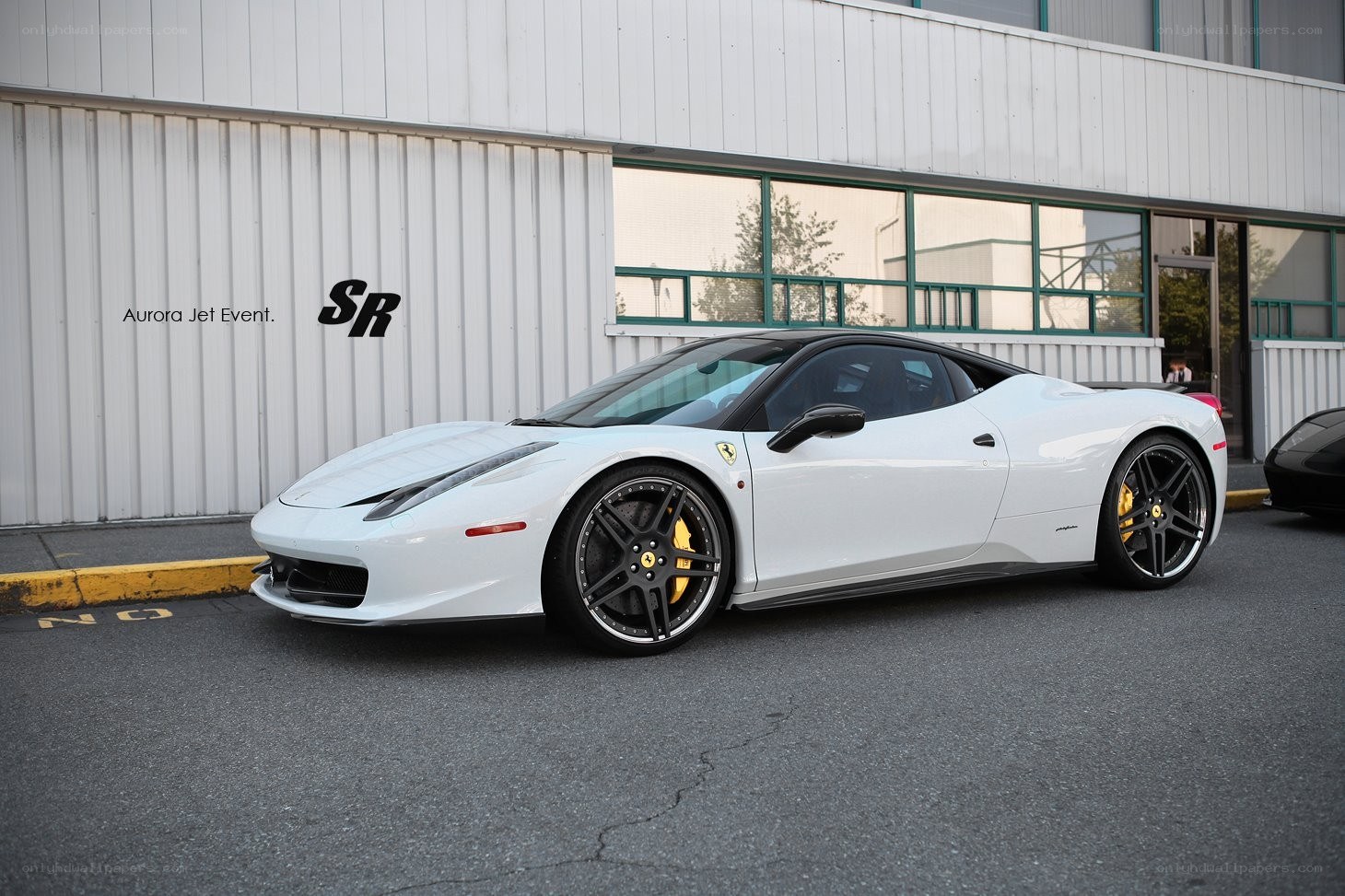 White Ferrari parked outside