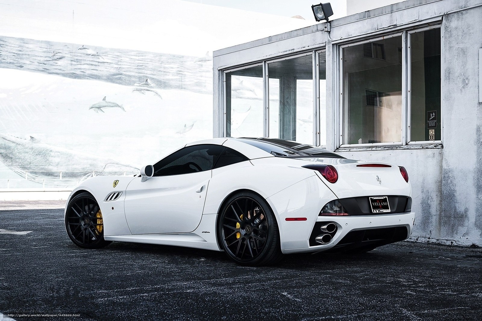 White Ferrari parked outside