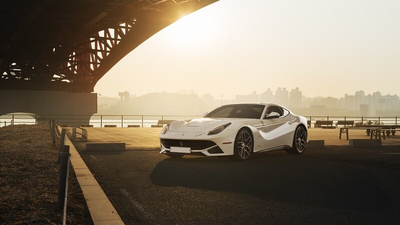 White Ferrari Sports Car — Dramatic, Sunset, Photograph, Bridge, City Skyline