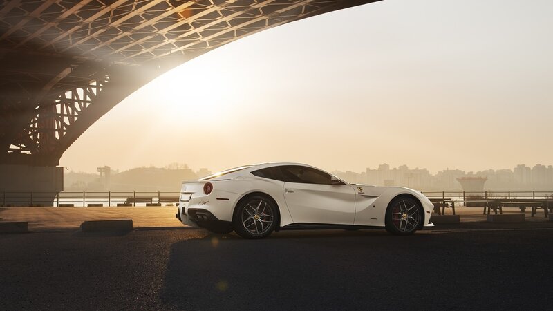 White Ferrari Sports Car — Dramatic, Sunset, Photograph, Bridge, Cityscape