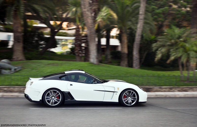 White Ferrari sports car in motion