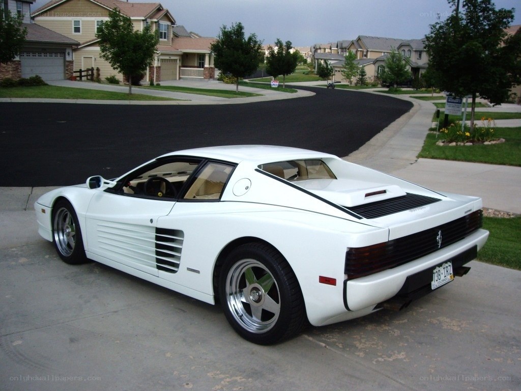 White Ferrari Testarossa in driveway