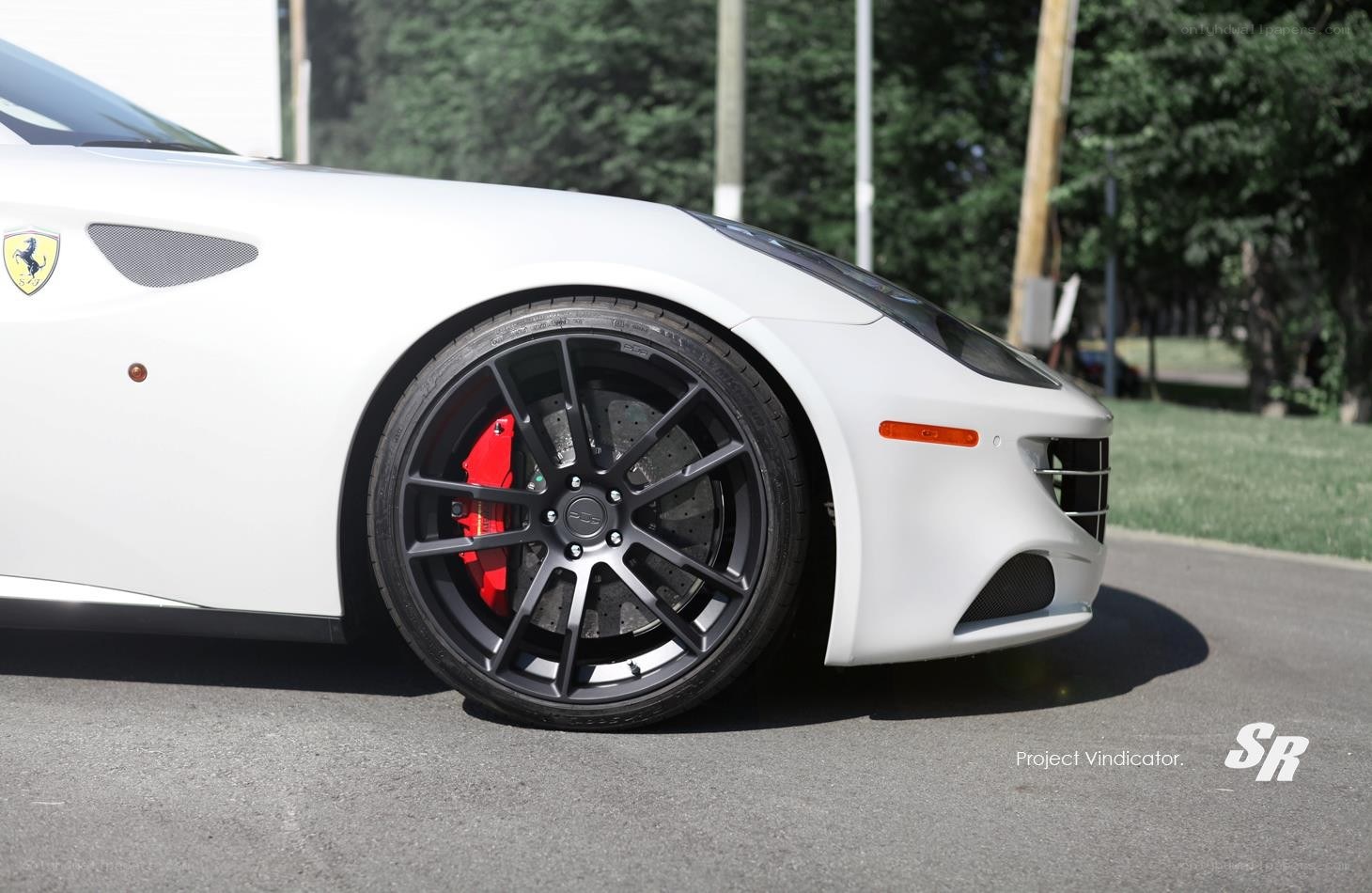 white ferrari with black wheels
