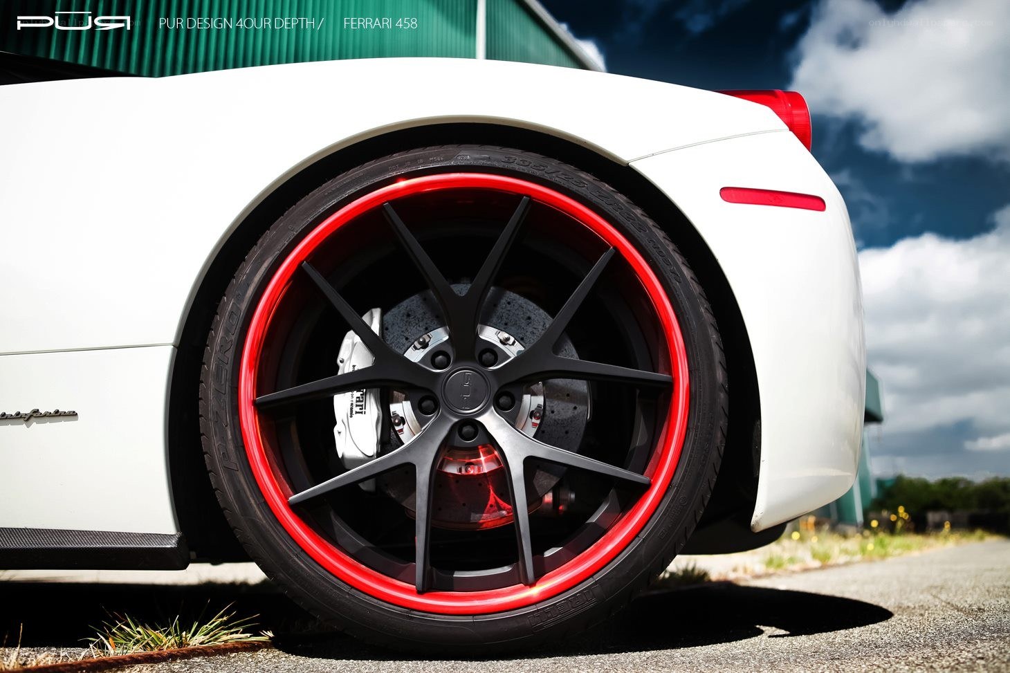 White Ferrari with red rims
