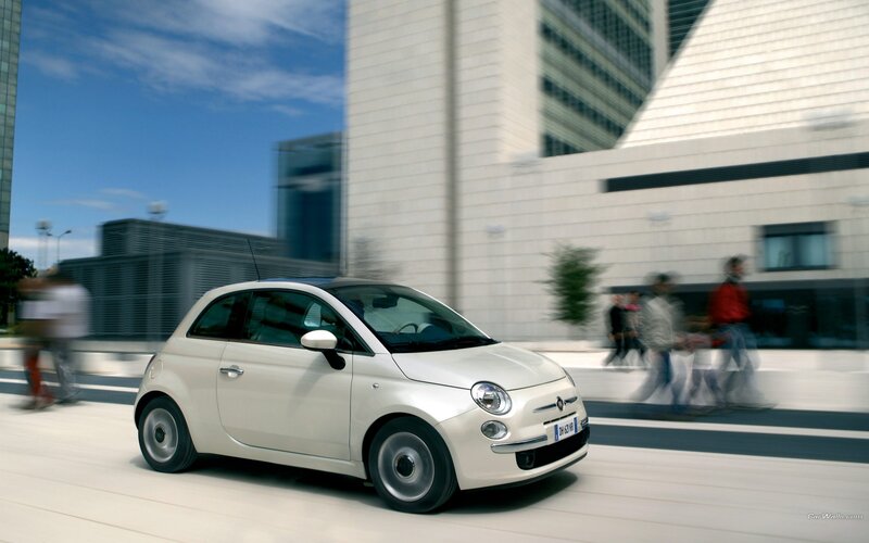 White Fiat 500 in city